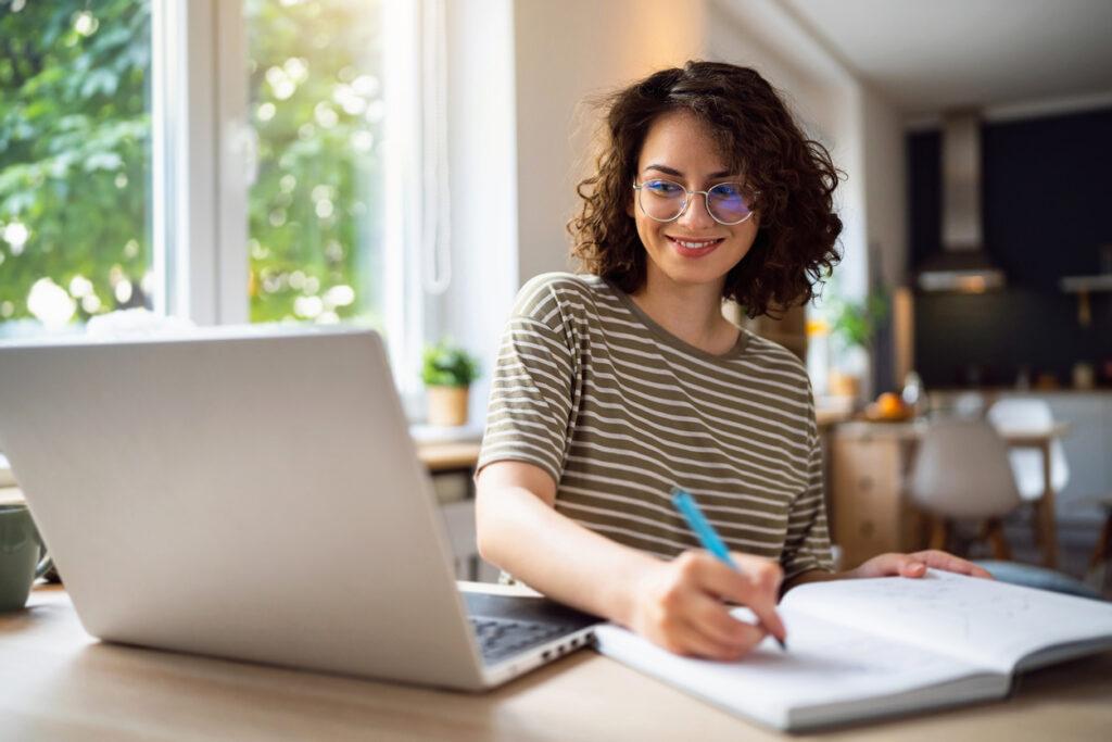young woman, a university student, studying online.