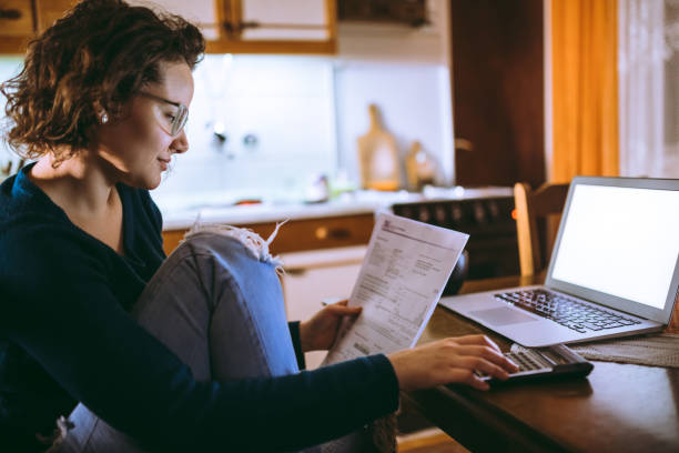 woman going through bills at home