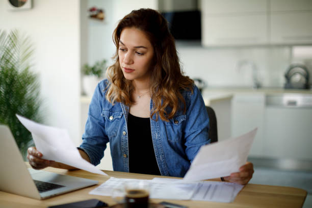 serious young woman working at home