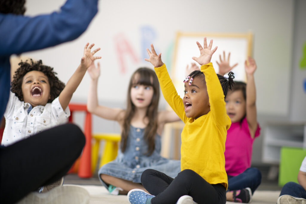multi ethnic group of preschool students in class