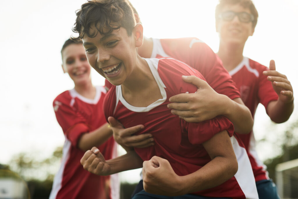 a soccer player celebrates a goal.