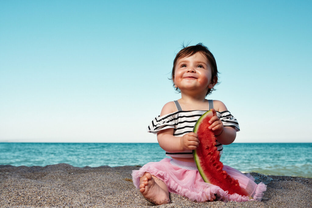 enjoying slice of watermelon