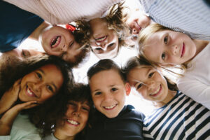 laughing group of kids in circle