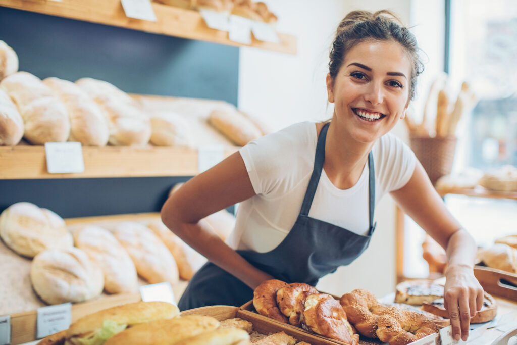 young woman selling bread and pastry