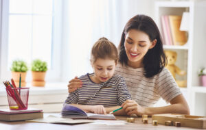 mother and daughter reading a book