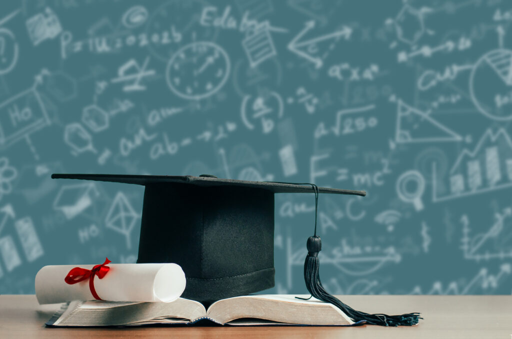 concept of education for student or student success. college and university tuition for education, investment, textbooks on the table